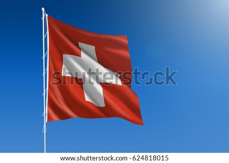 The National flag of Switzerland blowing in the wind in front of a clear blue sky