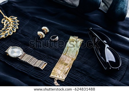 Female stylish black and golden outfit