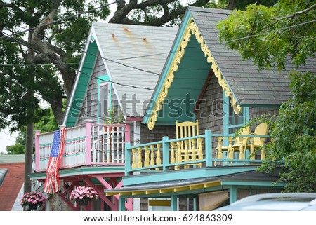 Carpenter Gothic Cottages with Victorian style, gingerbread trim in Wesleyan Grove, town of Oak Bluffs on Martha's Vineyard, Massachusetts, USA.  Royalty-Free Stock Photo #624863309