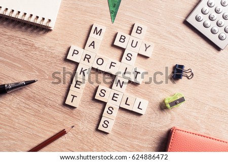Words of business marketing collected in crossword with wooden cubes