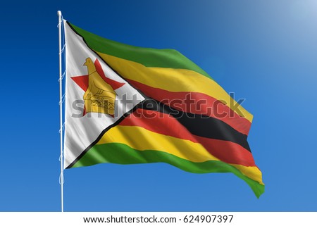 The National flag of Zimbabwe blowing in the wind in front of a clear blue sky