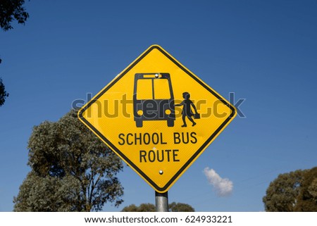Yellow bus stop sign