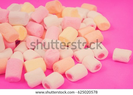 Marshmallow on a pink background. Pattern with marshmallow. Selective focus, Vintage style.