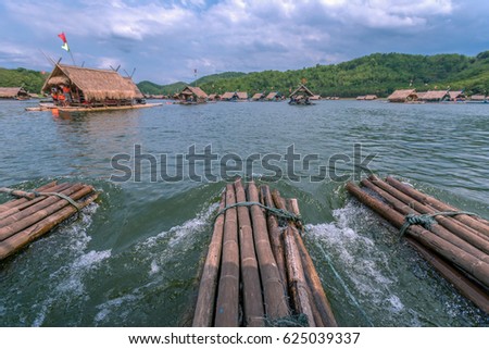 Raft with shelter on the lake restaurant. Front view with head of raft in focus while other raft and hill slightly blur in distance. At Huai Kra Thing, Loei, Thailand