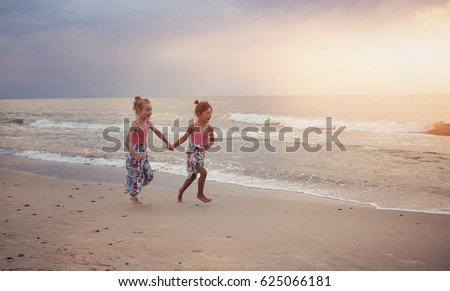 Friends have fun on the sunny beach