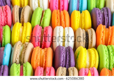 Colorful french macarons background, close up.Different colorful macaroons background.Tasty sweet color macaron,Bakery concept.Selective focus. Royalty-Free Stock Photo #625086380