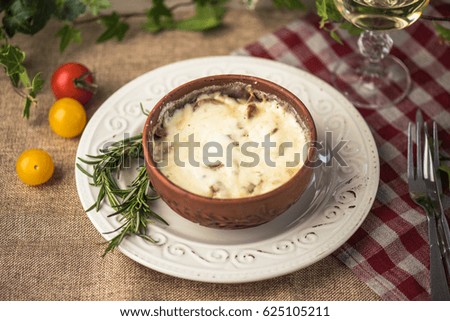 Snack of cheese, mushrooms and tomatoes on a wooden table close-up. Healthy food.