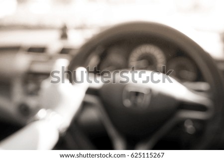 Picture blurred  for background abstract of hands driving car steering wheel