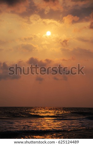 Sunset over the waters of the Indian Ocean. Magnificent seascape.