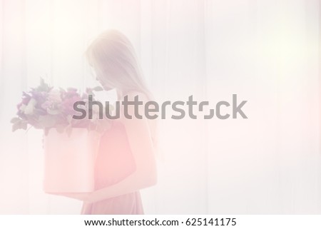 Soft focus and blurry girl with flowers