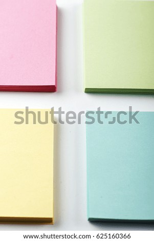Stack of paper notes. Isolated. Vertical shoot.