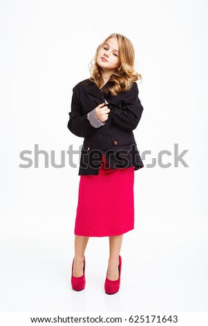 Charming girl in fancy outfit covering herself with black jacket.