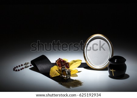 mourning frame with black urn and black tape, flower, yellow orchid, candle, for sympathy card on background