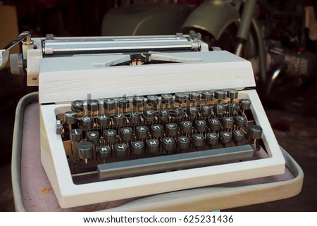 Old Vintage iron typewriter stands in the garage
