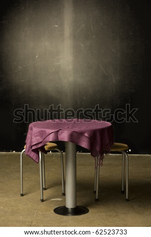 table and chairs in dark room
