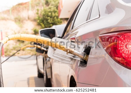 Cars charging at LPG gas stations Royalty-Free Stock Photo #625252481