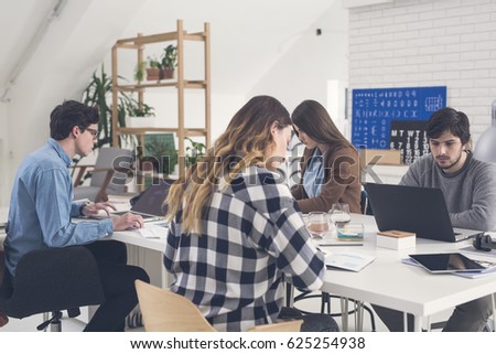 College Students Studying in Classroom