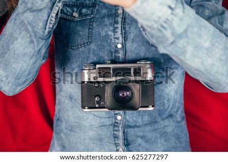 Young beautiful Girl with retro camera