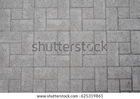A tile is a manufactured piece of hard-wearing material such as ceramic, stone, metal, or even glass, generally used for covering roofs, floors, walls, showers, or other objects such as tabletops.