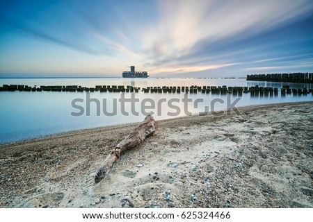 Wooden breakwaters line to the world war II torpedo platform at Baltic Sea, Babie Doly, Poland