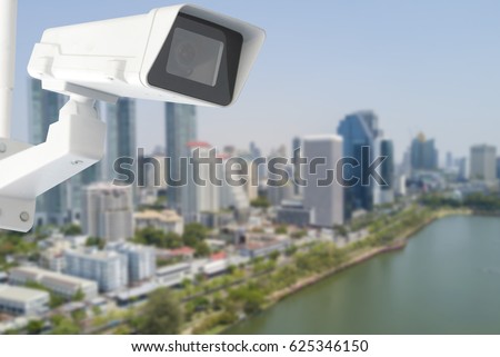 cctv camera with city in background