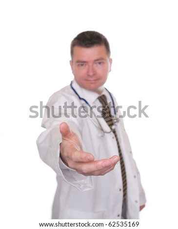 Doctor isolated on white offers handshake towards camera. Focus on hand.
