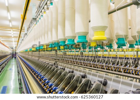 Coarse cotton factory in spinning production line and a rotating machinery and equipment production company Royalty-Free Stock Photo #625360127