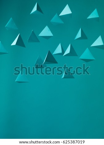 Abstract blue  paper pyramid background in space. Copy space available. Usefull for business cards and web