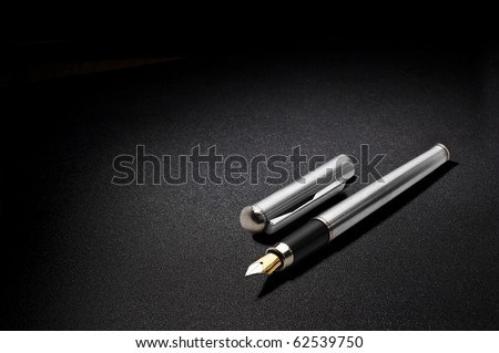 antique fountain pen on black background Royalty-Free Stock Photo #62539750