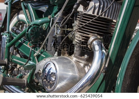 Retro motorcycle engine close-up of German carburetor