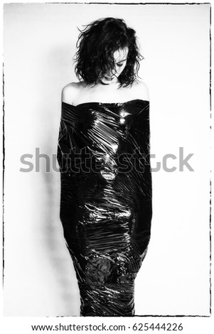 Pretty girl wrapped in black foil. Hard depression
