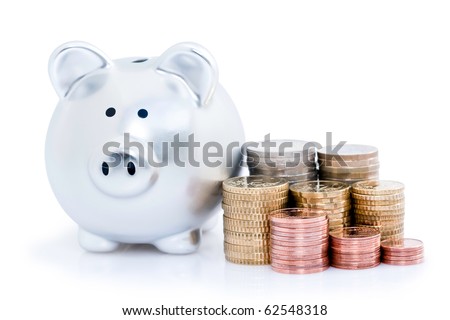 Stacks of Europeans coins with piggy bank, isolated on white background