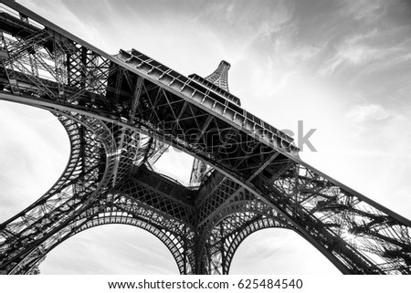 An abstract retro view of an Eiffel Tower against Sun in black and white colors, Paris, France