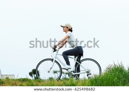 Woman riding a bike, cycling