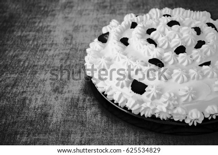Nice black and white image of a party cake on grungy background
