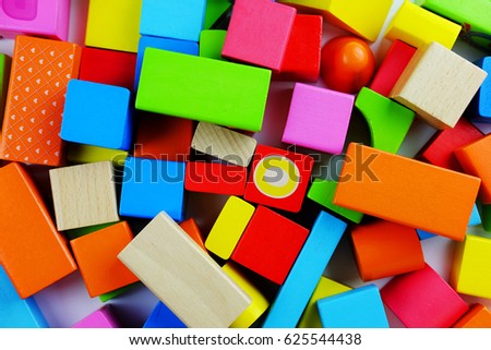 Color wooden block on white background, copy space.
