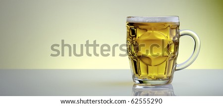 beer mug with a yellow background