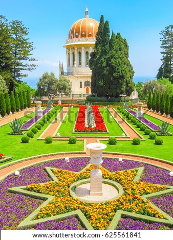 Shrine of Bab with beautiful Bahai garden and blossoming flowers in star form flowerbed. Haifa, Israel.