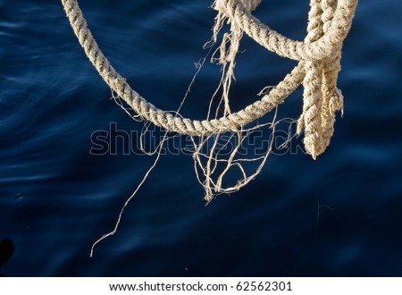 Nautical rope with deep blue water on the background