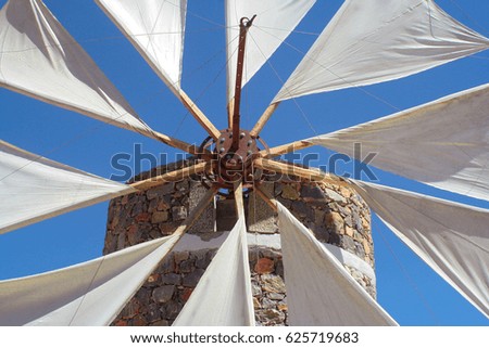 Detail of a windmill at Crete against a blue sky