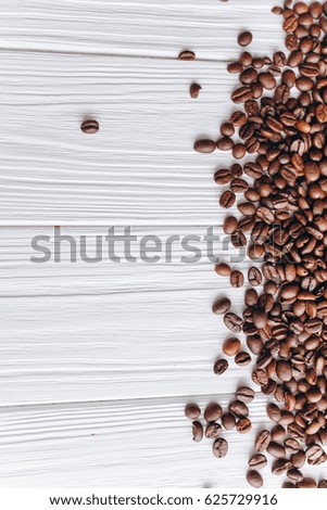 coffee beans on a white wooden background
