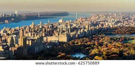 Panoramic elevated view of Central Park, Upper West Side and the George Washington Bridge with Hudson River in Fall. Manhattan, New York CIty Royalty-Free Stock Photo #625750889