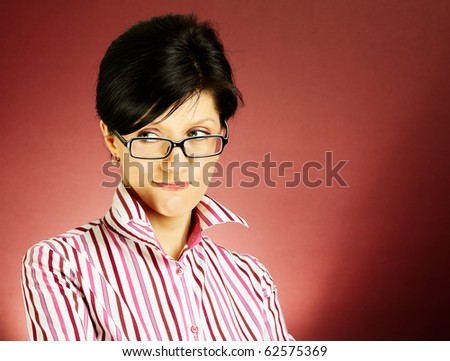 Nerdy office woman over bordeaux background looking ecstatic