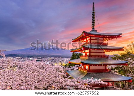 Fujiyoshida, Japan at Chureito Pagoda and Mt. Fuji in the spring with cherry blossoms. Royalty-Free Stock Photo #625757552