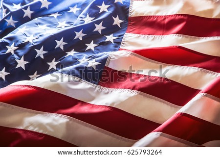 American flag waving in the wind. Royalty-Free Stock Photo #625793264
