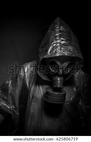 Ebola infection concept, man with red gas mask