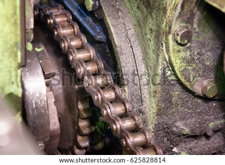 Drive roller chain and sprocket. Industrial chain drive in operation