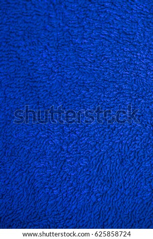 Dark blue fabric texture. Dark blue cloth background. Close up view of dark blue fabric texture and background. Abstract background and texture for designers. Navy blue texture.
