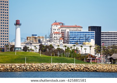 Cityscape of Long Beach with lighthouse and palms
