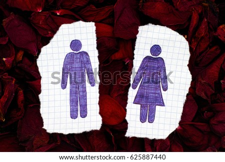 Two pieces of paper with hand drawn man and woman figures on dry petals of roses background. Doodle style.